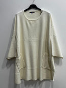 Blusa morbida modal con tasche