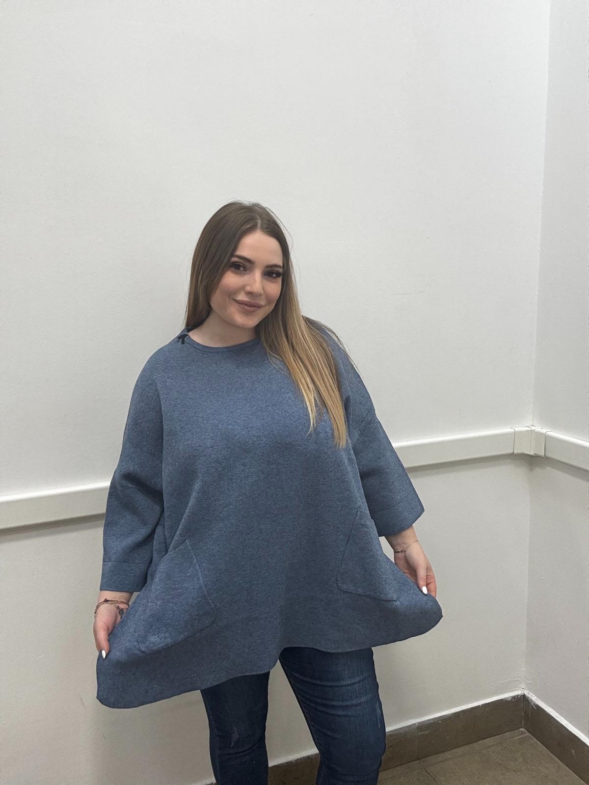 Blusa morbida modal con tasche